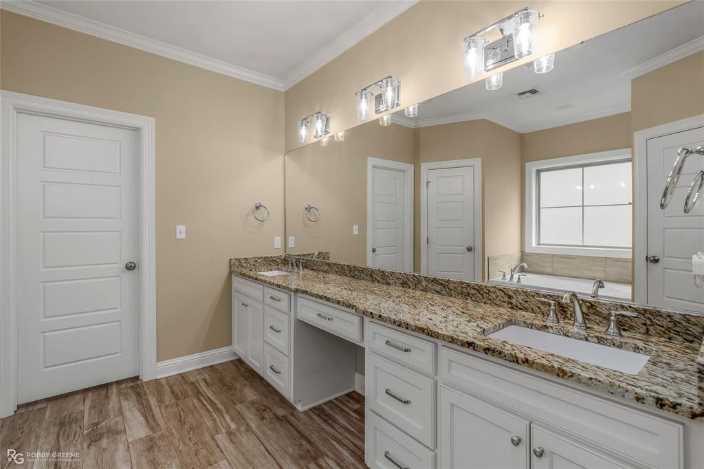 352 Wood Springs Haughton, LA 71037 - Photo 9 of 34 a bathroom with a granite countertop double vanity sink and mirror