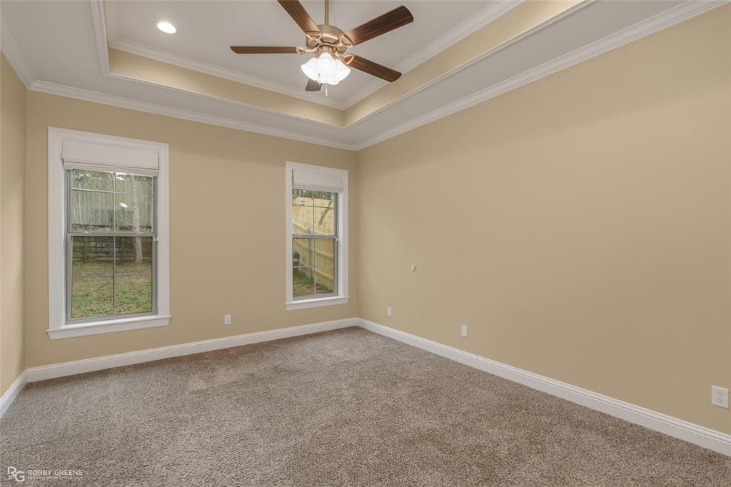 352 Wood Springs Haughton, LA 71037 - Photo 10 of 34 an empty room with windows and fan