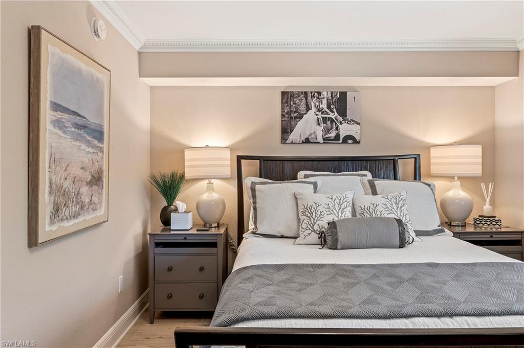 950 7th Avenue South, Unit 23 Naples, FL 34102 - Photo 12 of 40 a bedroom with a large bed and a window