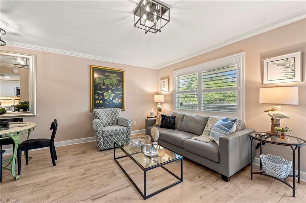 950 7th Avenue South, Unit 23 Naples, FL 34102 - Photo 5 of 40 a living room with furniture and a window