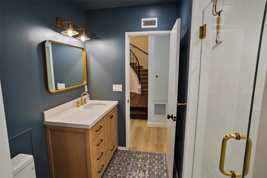 1925 Parkside Avenue Burbank, CA 91506 - Photo 12 of 30 a bathroom with a sink a toilet and mirror