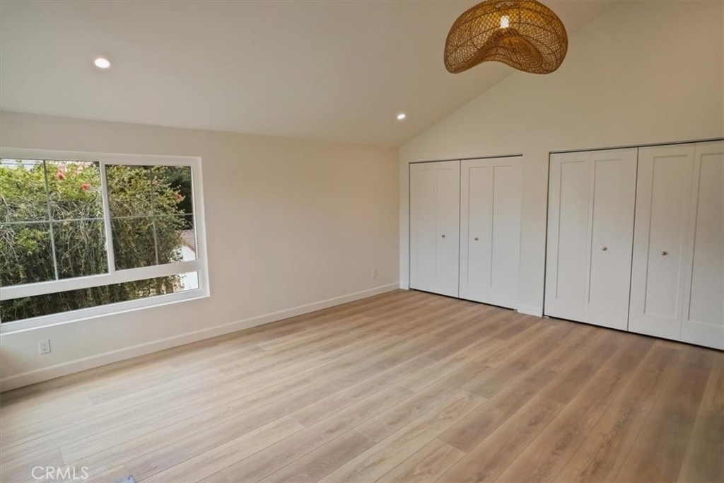 1925 Parkside Avenue Burbank, CA 91506 - Photo 15 of 30 a view of an empty room with wooden floor and windows