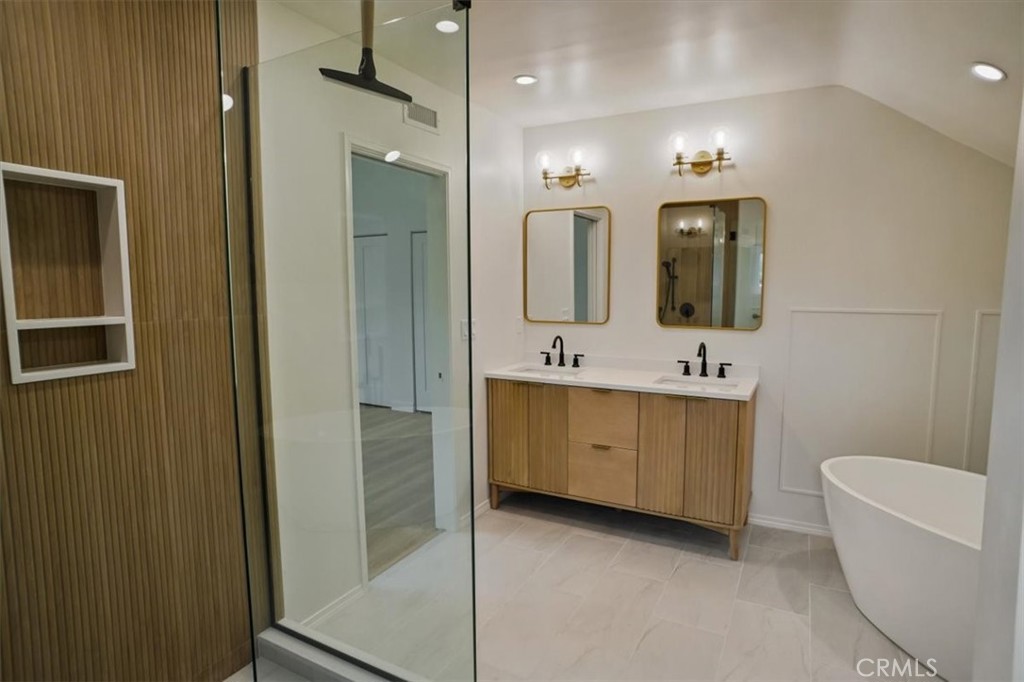 1925 Parkside Avenue Burbank, CA 91506 - Photo 16 of 30 a bathroom with a double vanity sink a toilet a mirror and shower