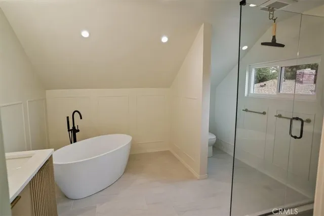 a bathroom with a bathtub and shower