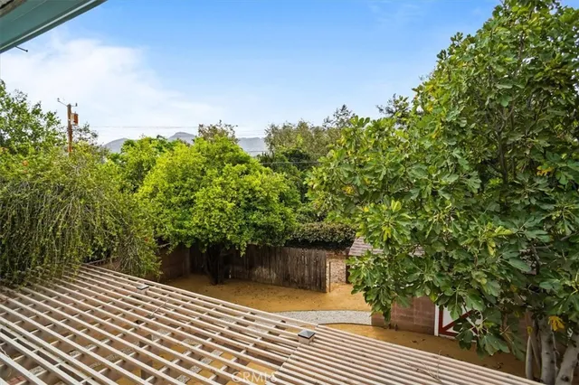 a view of a backyard of the house
