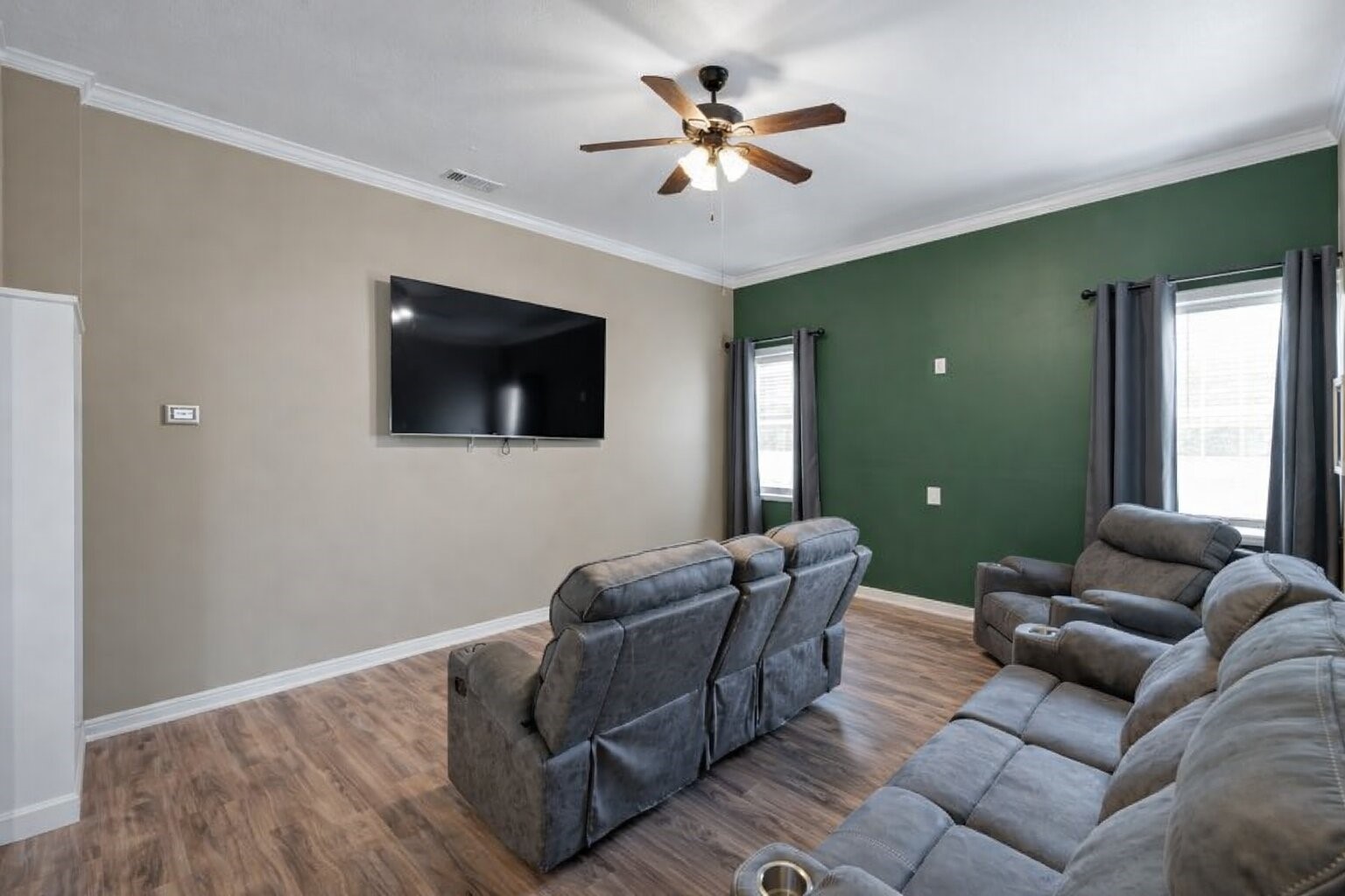 144 Wood Farm Road Huntsville, TX 77320 - Photo 16 of 35 a living room with furniture and a flat screen tv