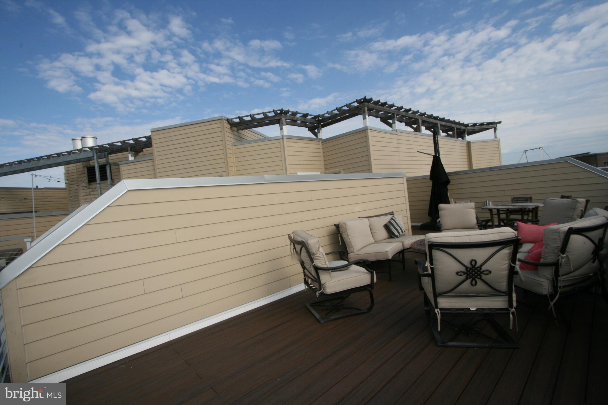2550 17th Street Northwest, Unit 612 Washington, DC 20009 - Photo 35 of 55 a view of a terrace with seating area