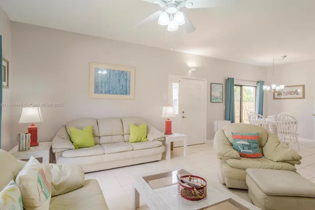 a living room with furniture and a lamp