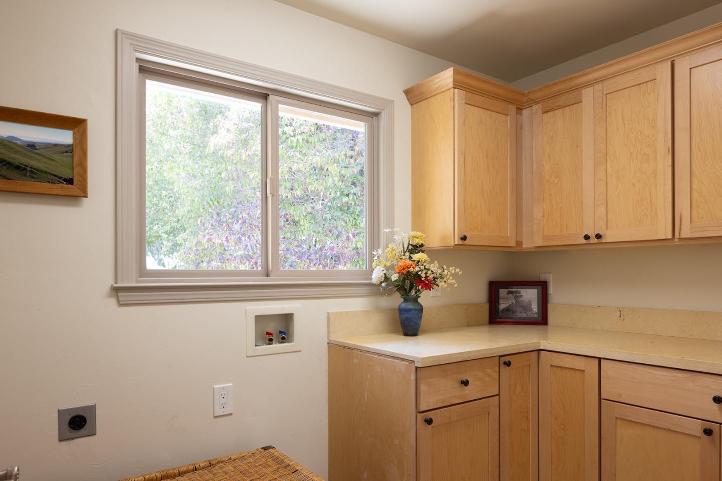 594 Viejo Road Carmel, CA 93923 - Photo 18 of 23 a view of a kitchen with a sink a microwave and cabinets