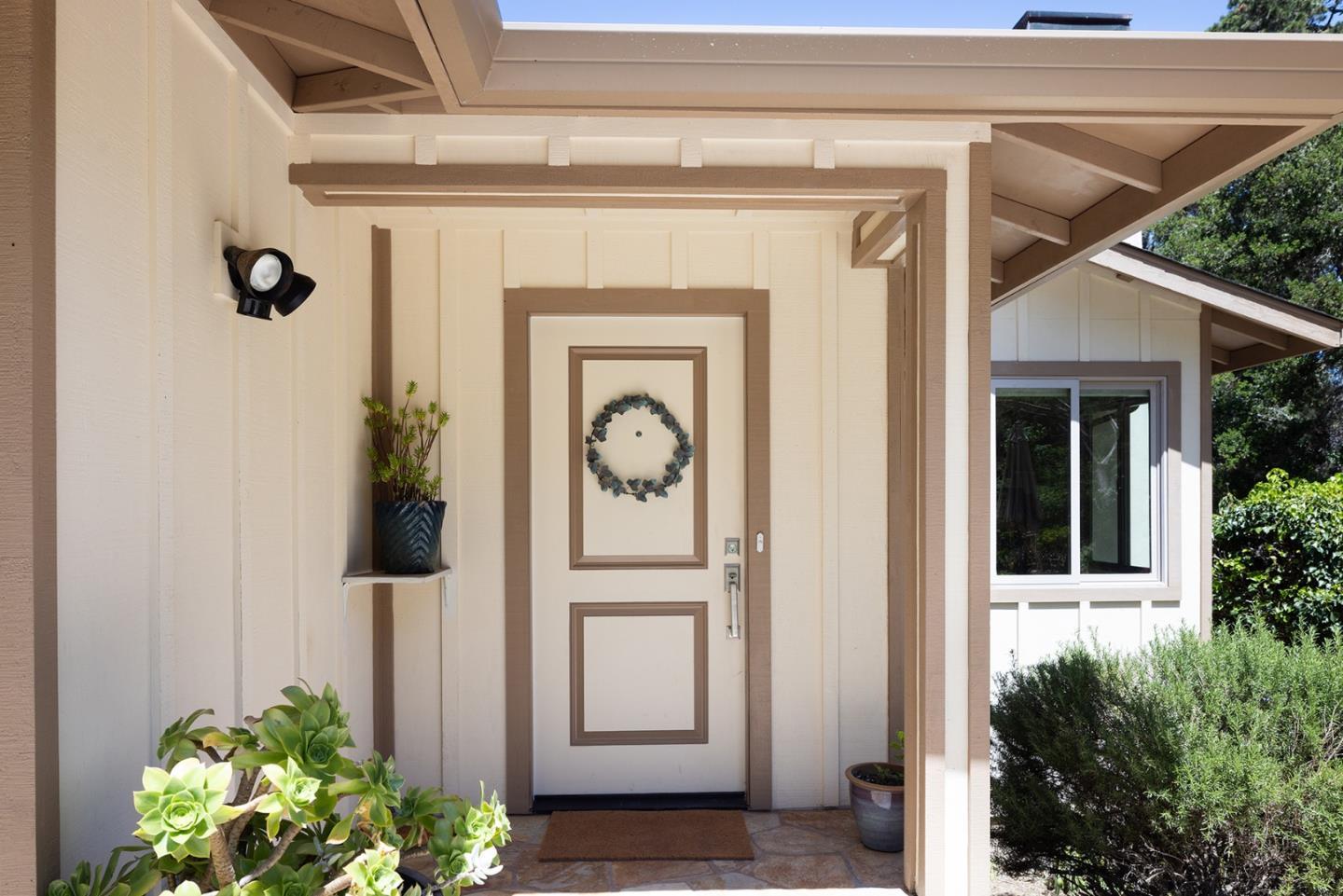 594 Viejo Road Carmel, CA 93923 - Photo 4 of 23 a front view of a house with plants