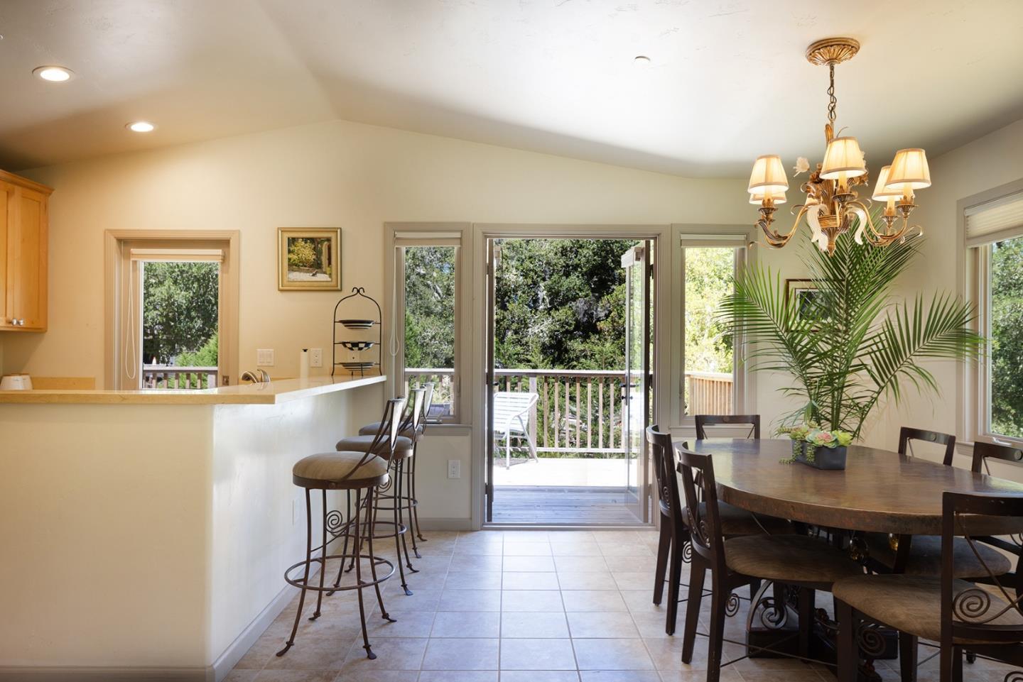 594 Viejo Road Carmel, CA 93923 - Photo 7 of 23 a view of a dining room with furniture window and outside view