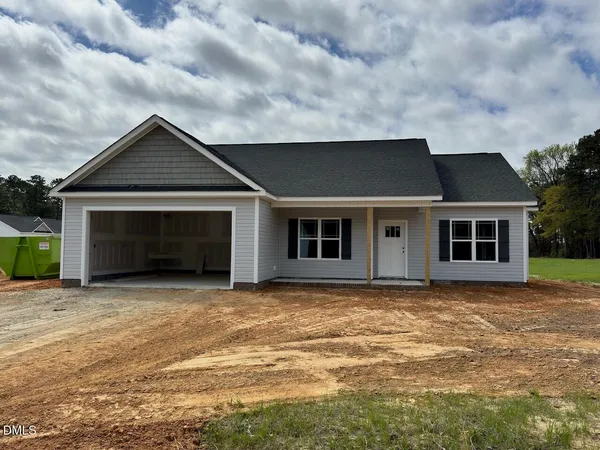 a house with yard in front of it