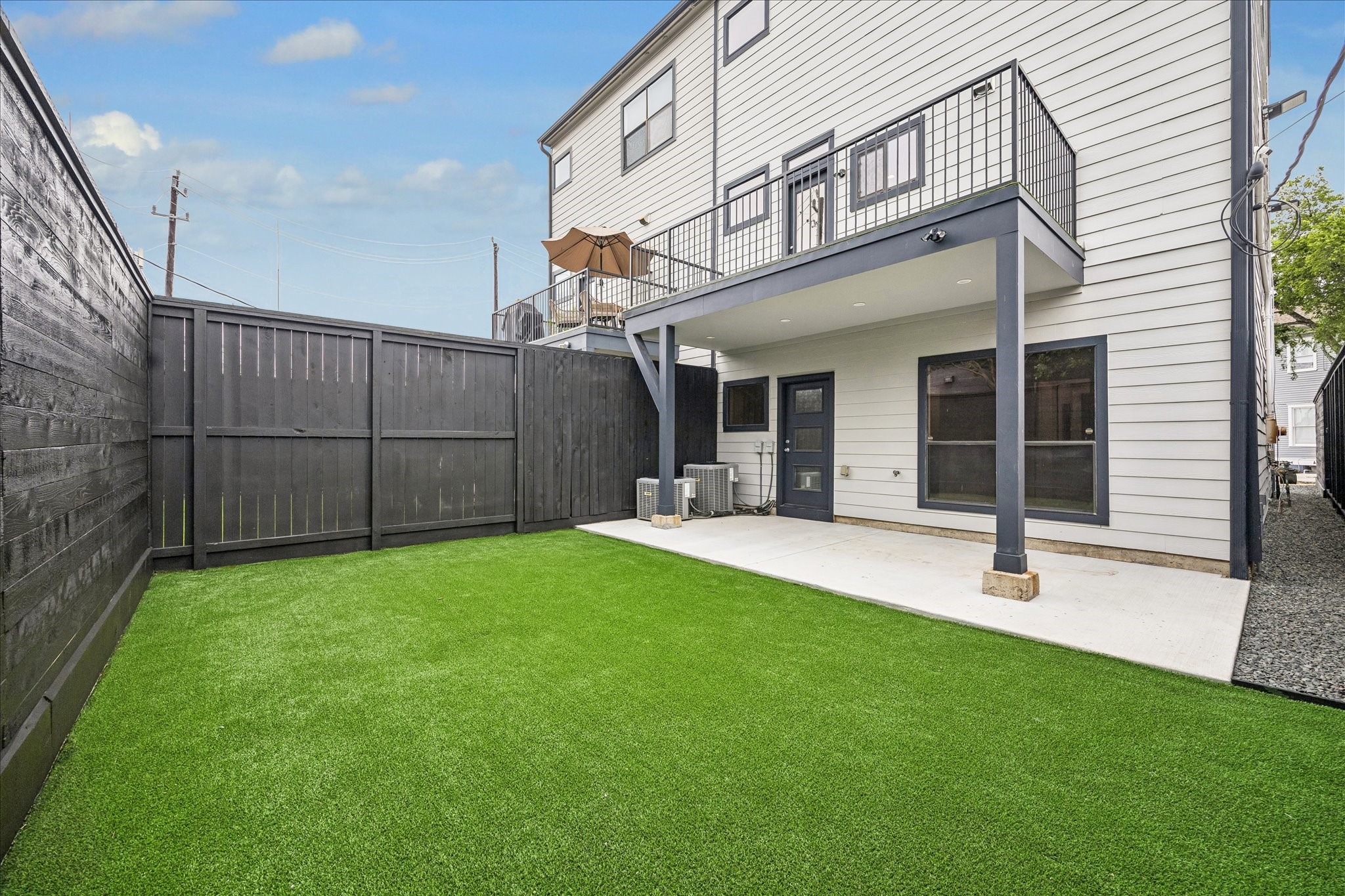 2510 Genesee Street Houston, TX 77006 - Photo 35 of 40 Backyard is features a concrete patio area new fence and new synthetic turf grass