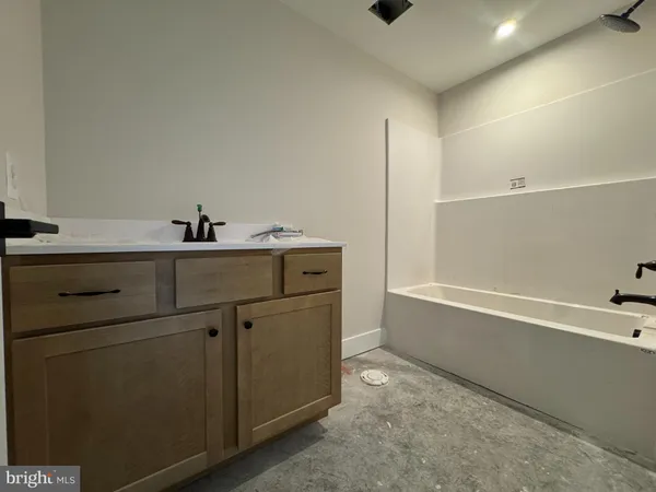a bathroom with a sink and a bathtub