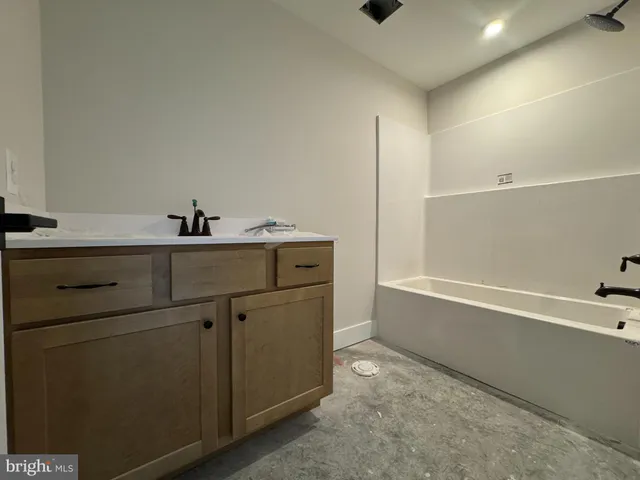 a bathroom with a sink and a bathtub