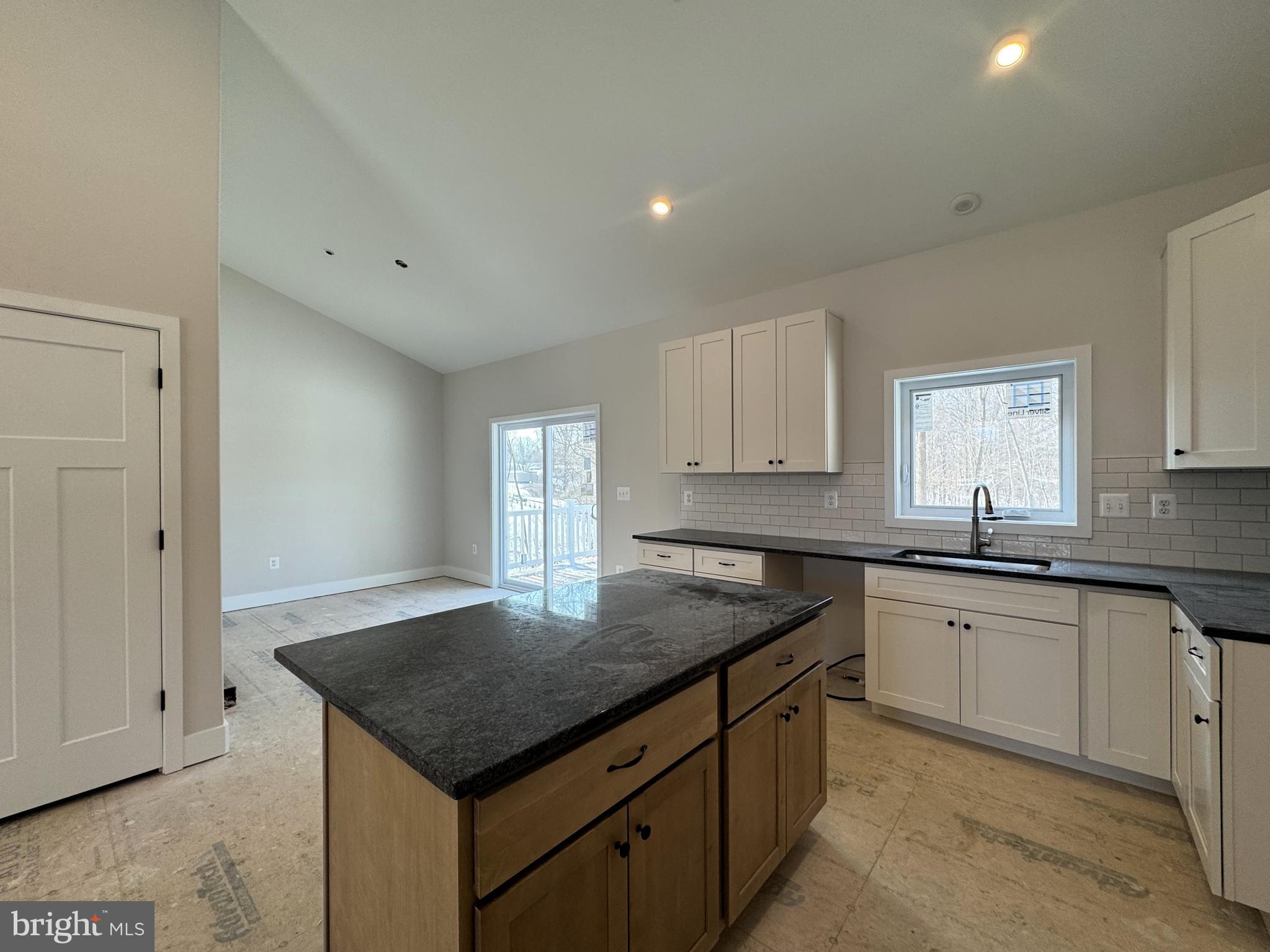 1362 Solomons Island Road Huntingtown, MD 20639 - Photo 3 of 16 a kitchen with a sink dishwasher and stove