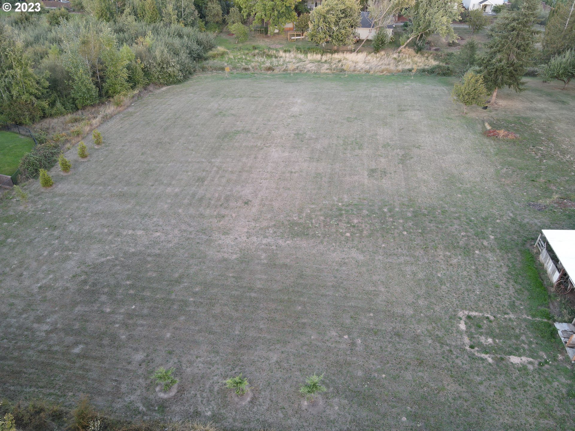 0 North 1st Street Ridgefield, WA 98642 - Photo 2 of 7 a view of a dry yard with wooden fence