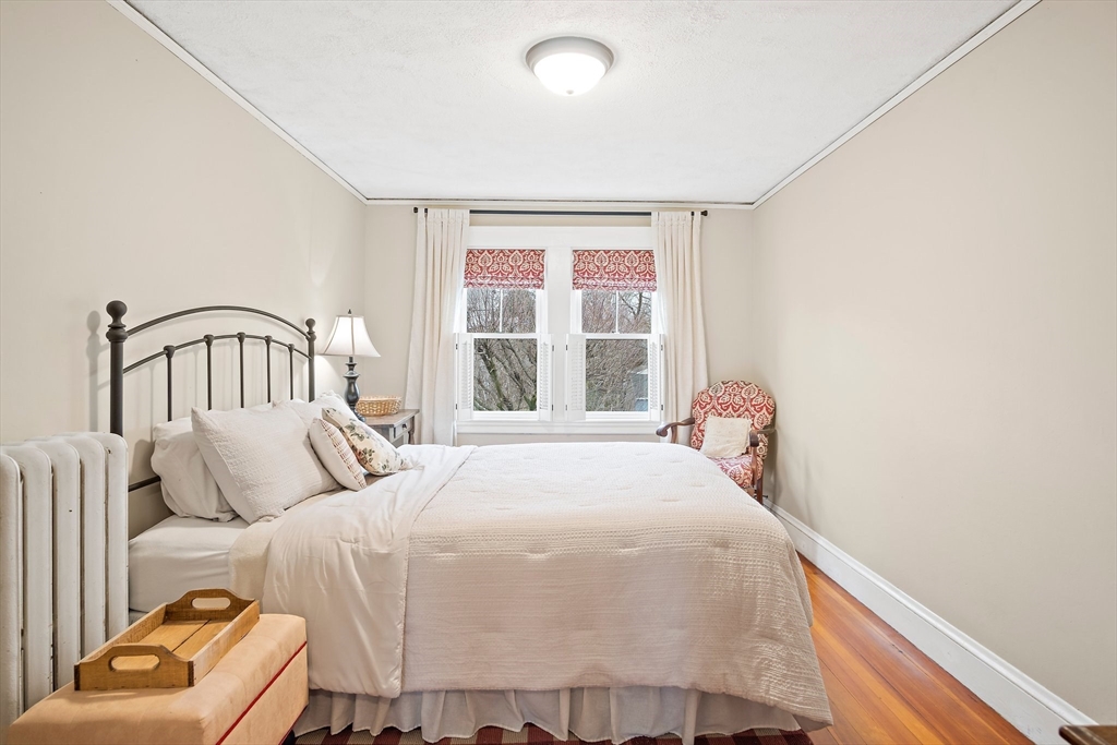 8 Flagg Street Woburn, MA 01801 - Photo 15 of 25 a bedroom with a bed and a window