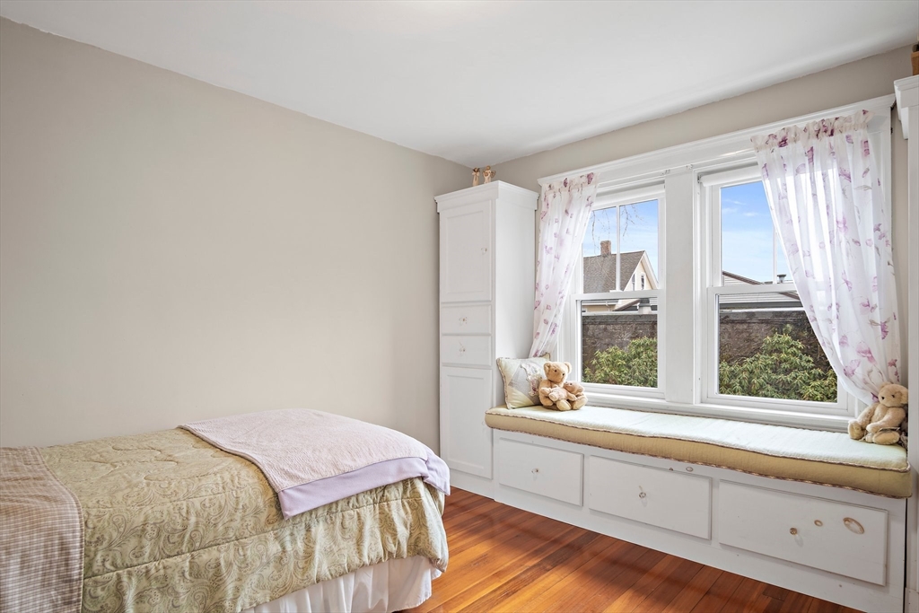 8 Flagg Street Woburn, MA 01801 - Photo 16 of 25 a bedroom with a bed and a large window