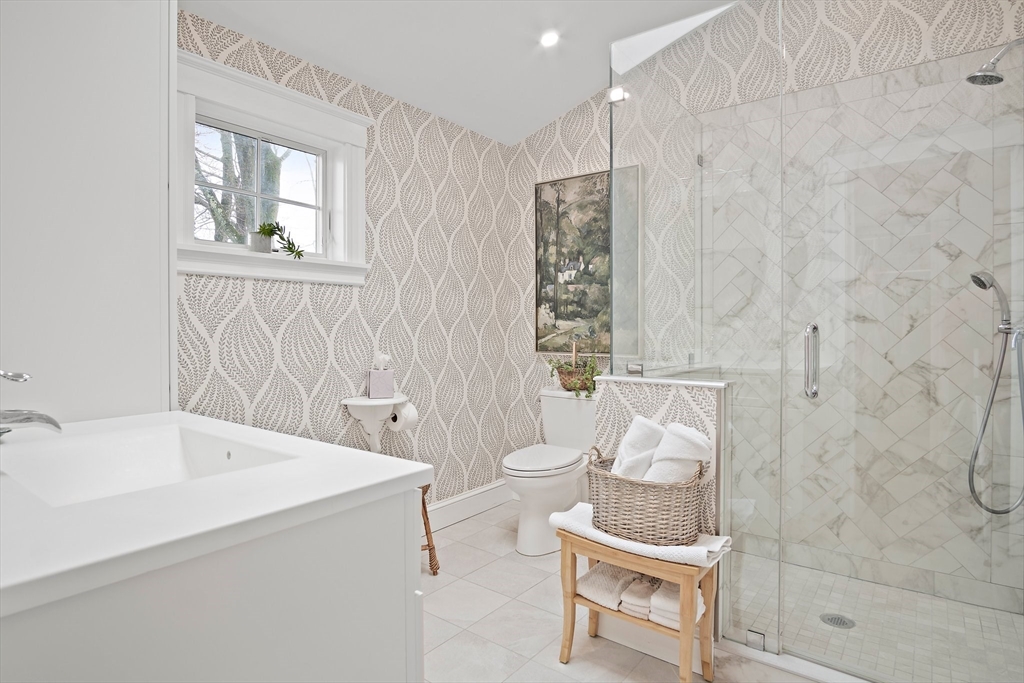 8 Flagg Street Woburn, MA 01801 - Photo 18 of 25 a bathroom with a sink and a mirror