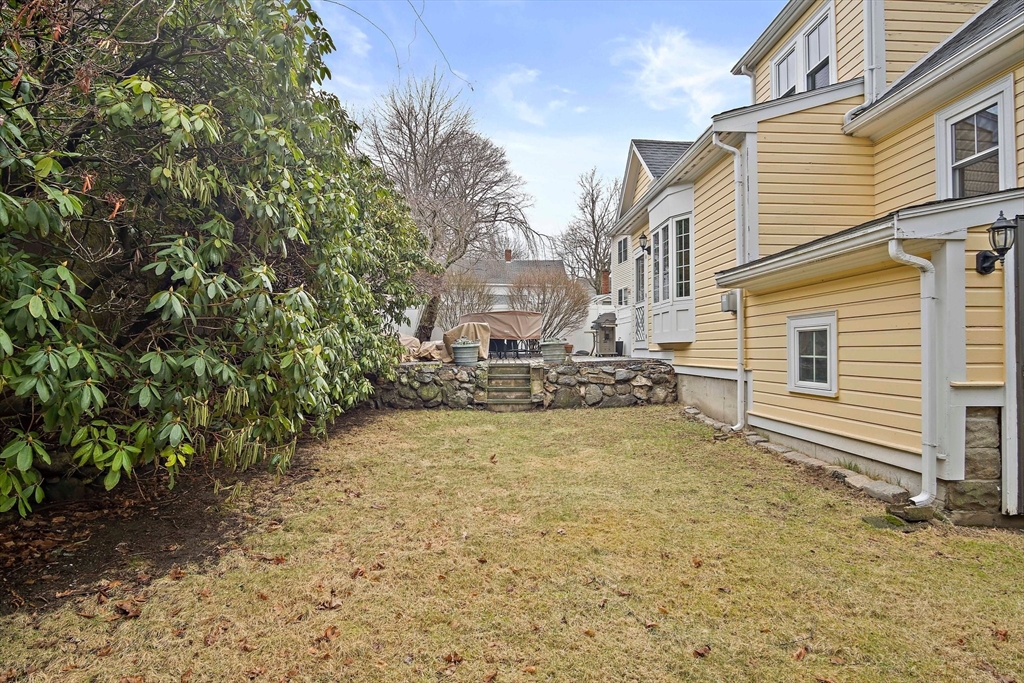 8 Flagg Street Woburn, MA 01801 - Photo 21 of 25 a view of a house with a yard