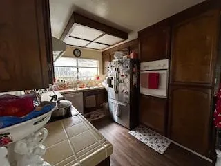 a kitchen with refrigerator and window