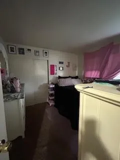 a utility room with cabinets washer and dryer