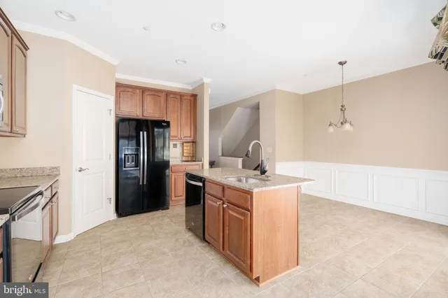 a kitchen with a stove and a refrigerator