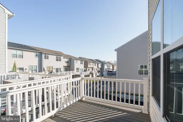 a view of a balcony with wooden floor