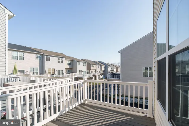 a view of a balcony with wooden floor