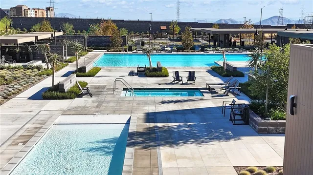 a view of a swimming pool with a patio