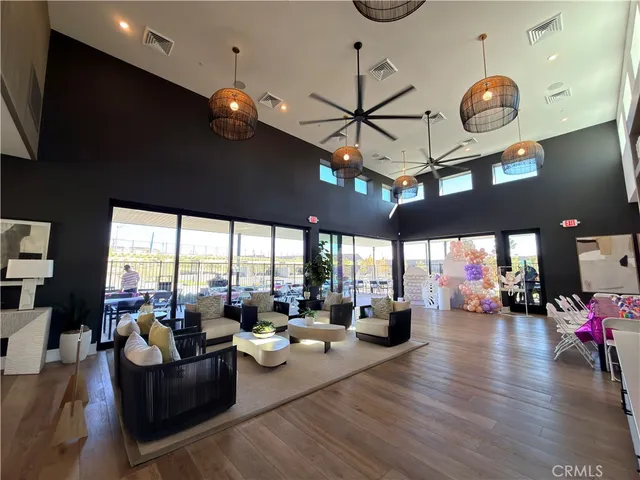 a living room with lots of furniture and window