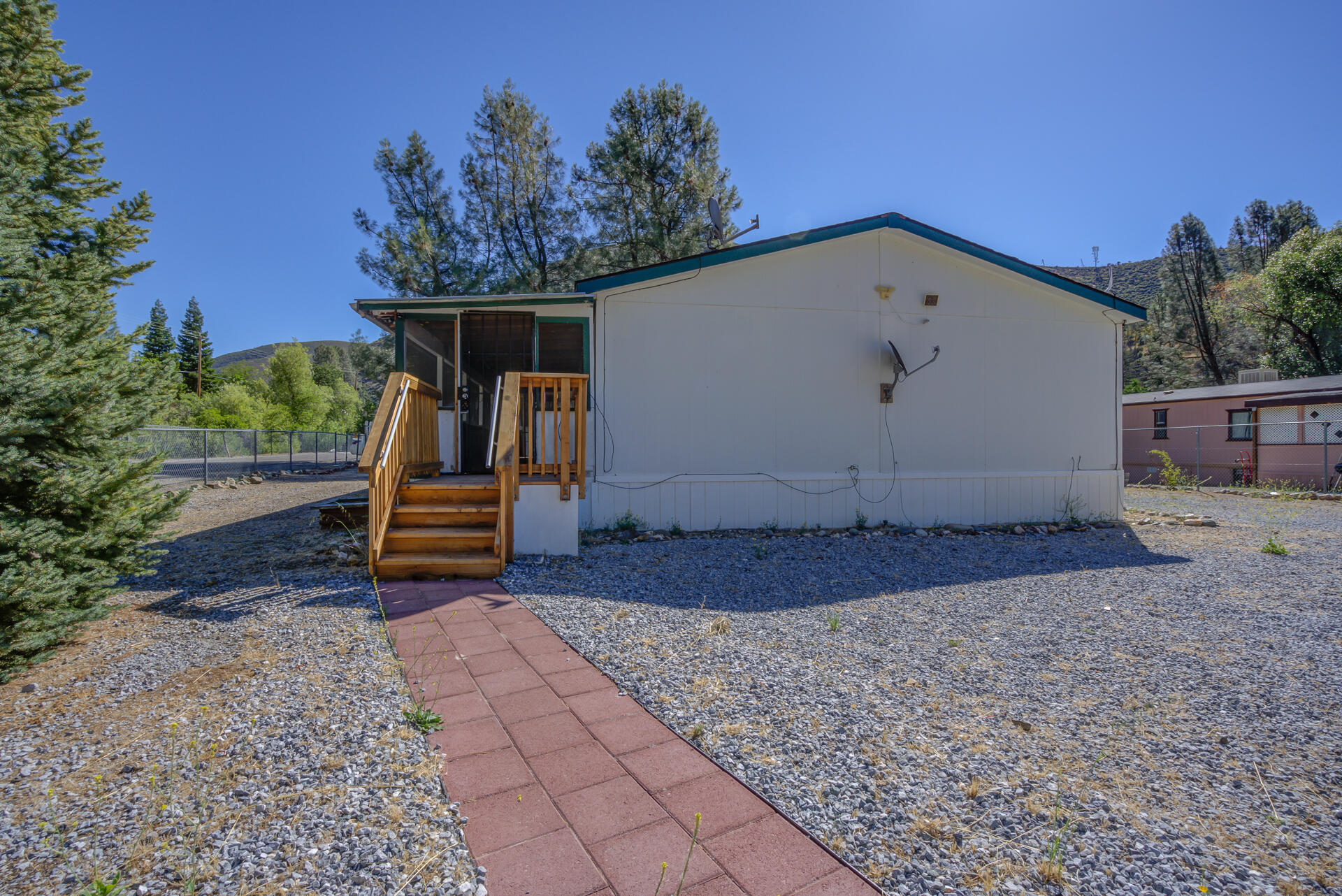 13905 Trinity Mountain Road, Unit CLEAR CREEK MOBILE PARK French Gulch, CA 96033 - Photo 2 of 24 a view of backyard with a barn and a cactus plant