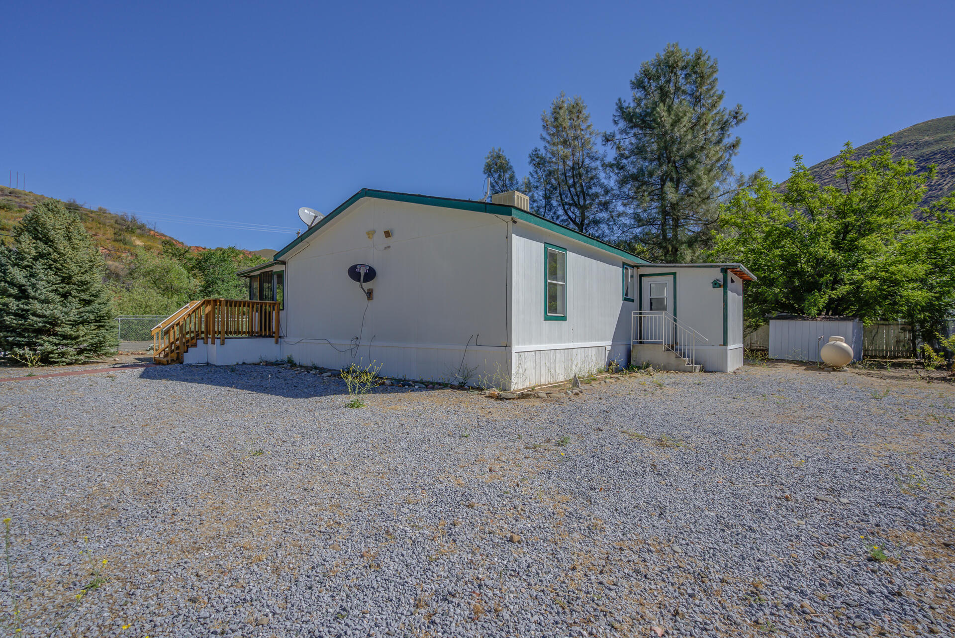 13905 Trinity Mountain Road, Unit CLEAR CREEK MOBILE PARK French Gulch, CA 96033 - Photo 3 of 24 a view of a house with backyard and trees