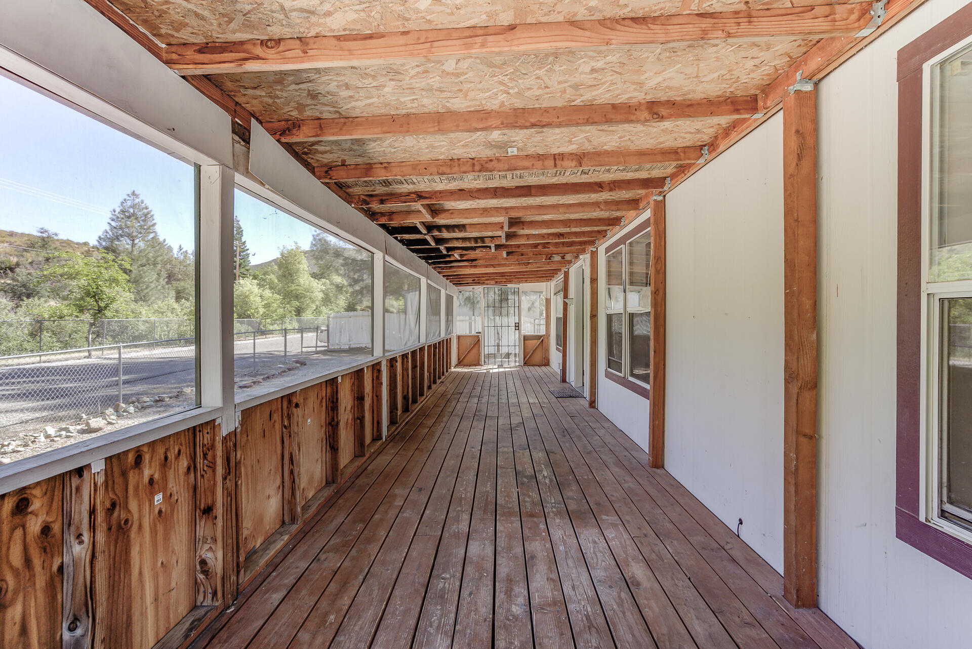 13905 Trinity Mountain Road, Unit CLEAR CREEK MOBILE PARK French Gulch, CA 96033 - Photo 5 of 24 a view of a balcony with wooden floor