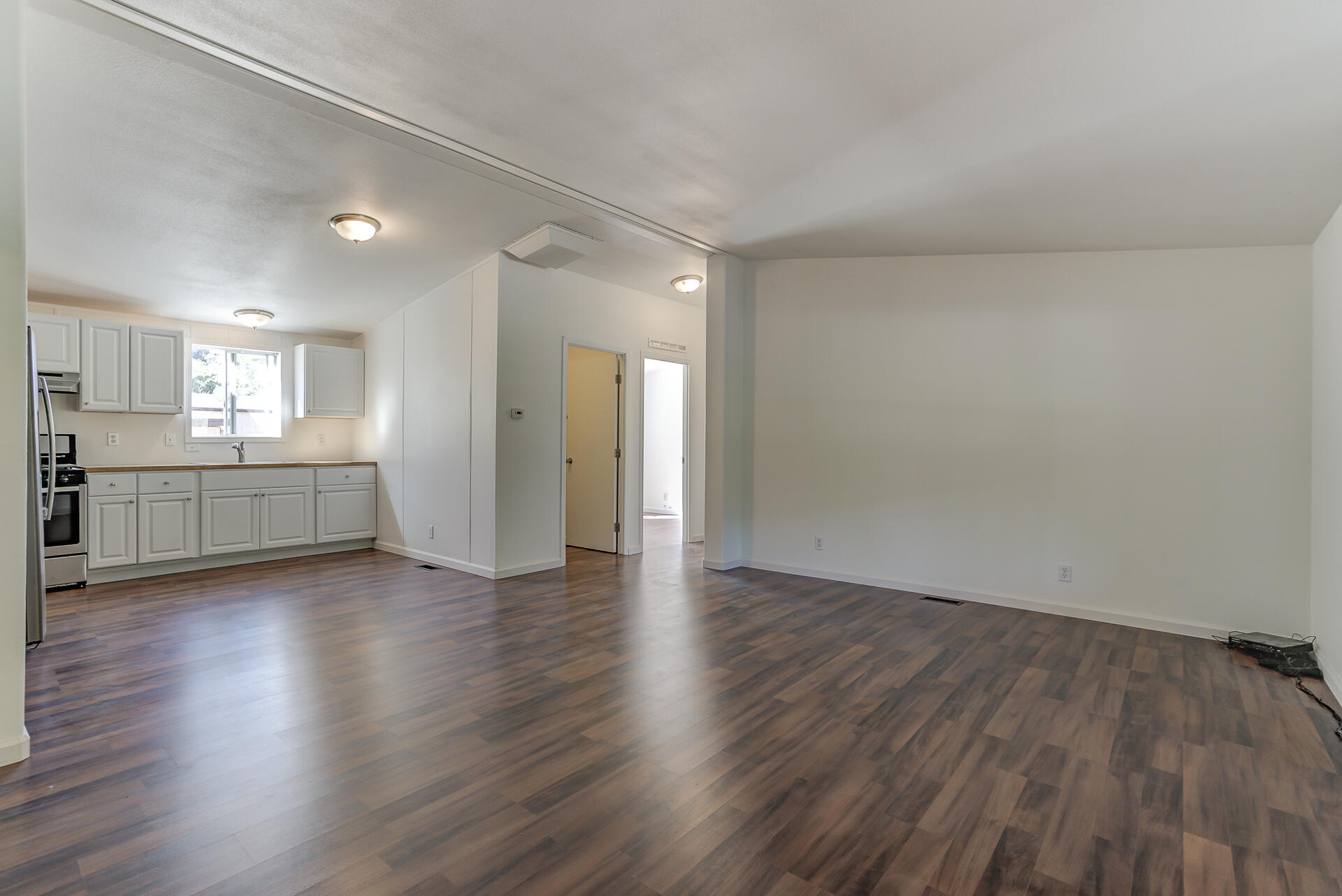 13905 Trinity Mountain Road, Unit CLEAR CREEK MOBILE PARK French Gulch, CA 96033 - Photo 6 of 24 a view of a kitchen with wooden floor and a sink