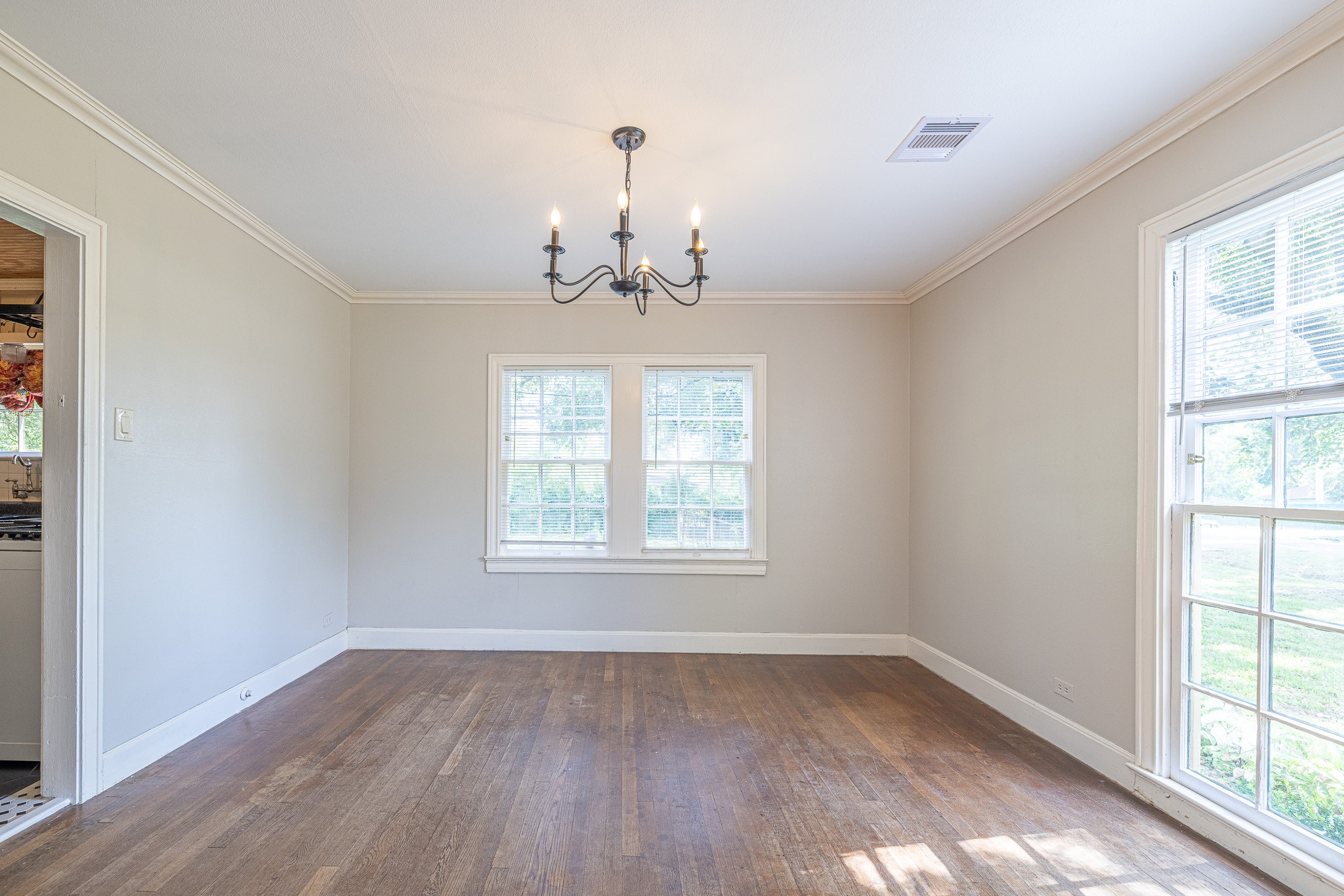 8548 Findlay Street Houston, TX 77017 - Photo 10 of 50 wooden floor in an empty room with a window