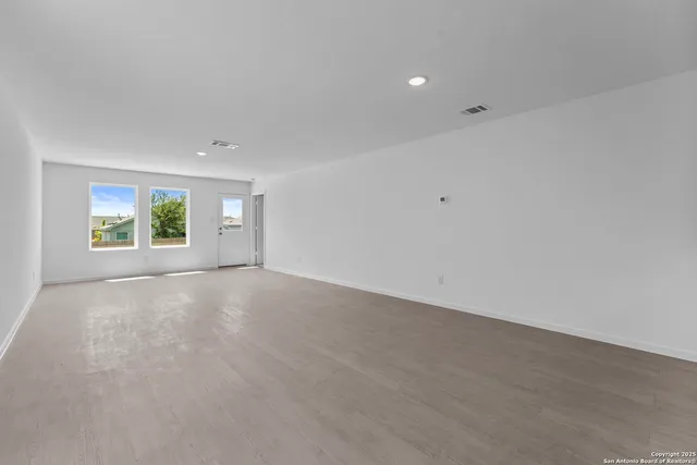 an empty room with windows