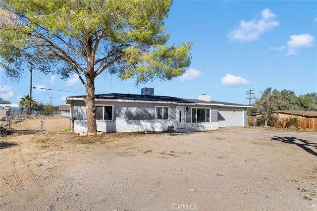 a view of a house with a snow in the yard
