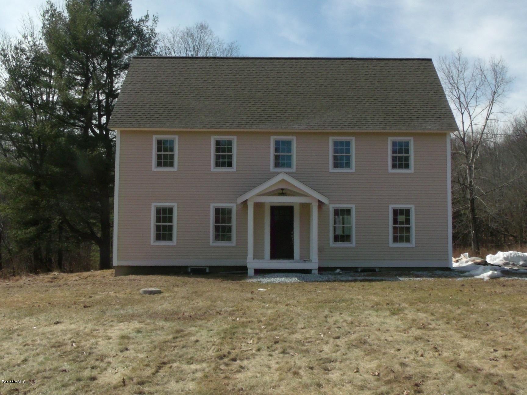 2986 State Road Richmond, MA 01254 - Photo 1 of 14 a front view of a house with a yard