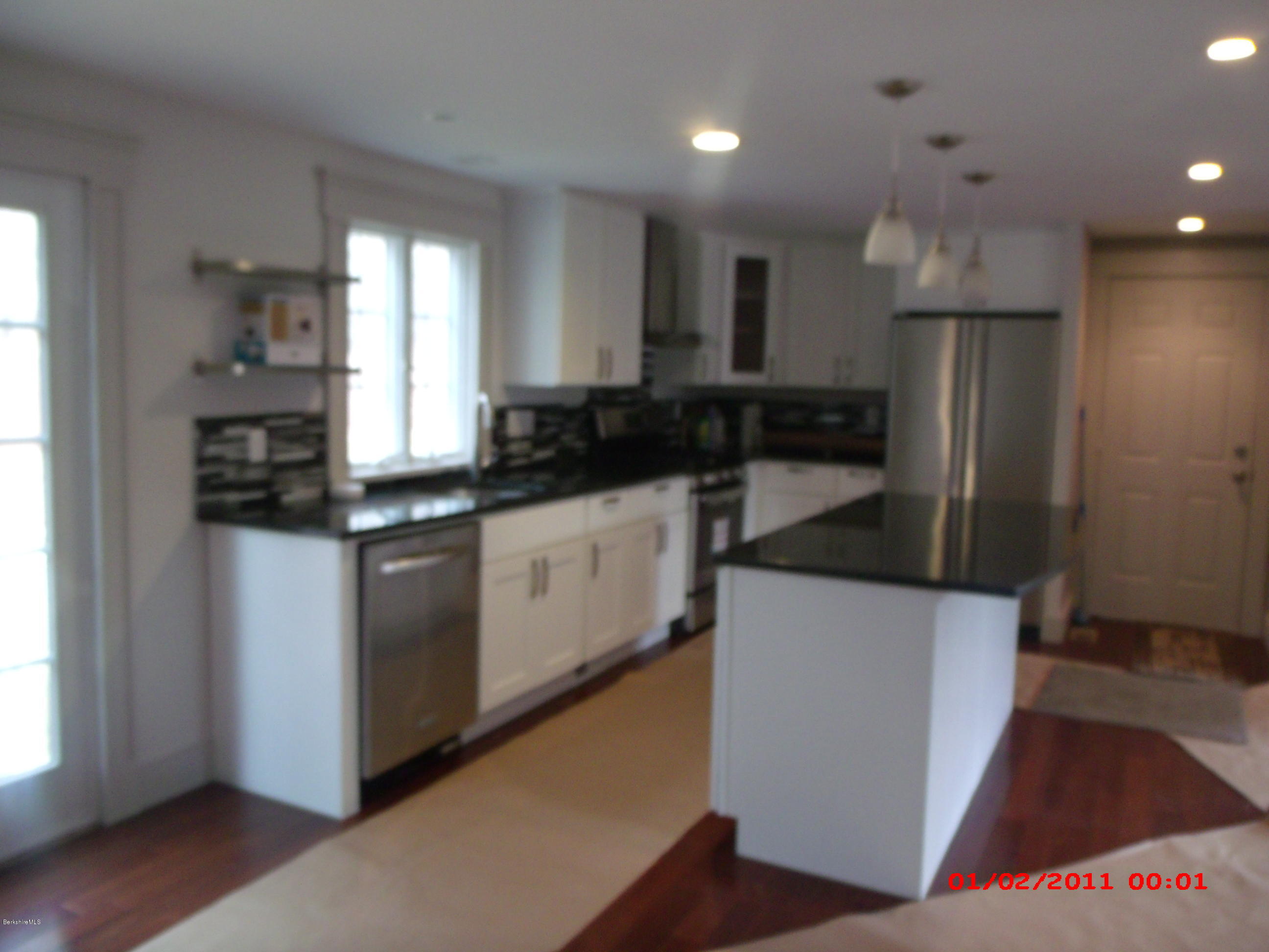 2986 State Road Richmond, MA 01254 - Photo 2 of 14 a kitchen with stainless steel appliances a sink stove and refrigerator