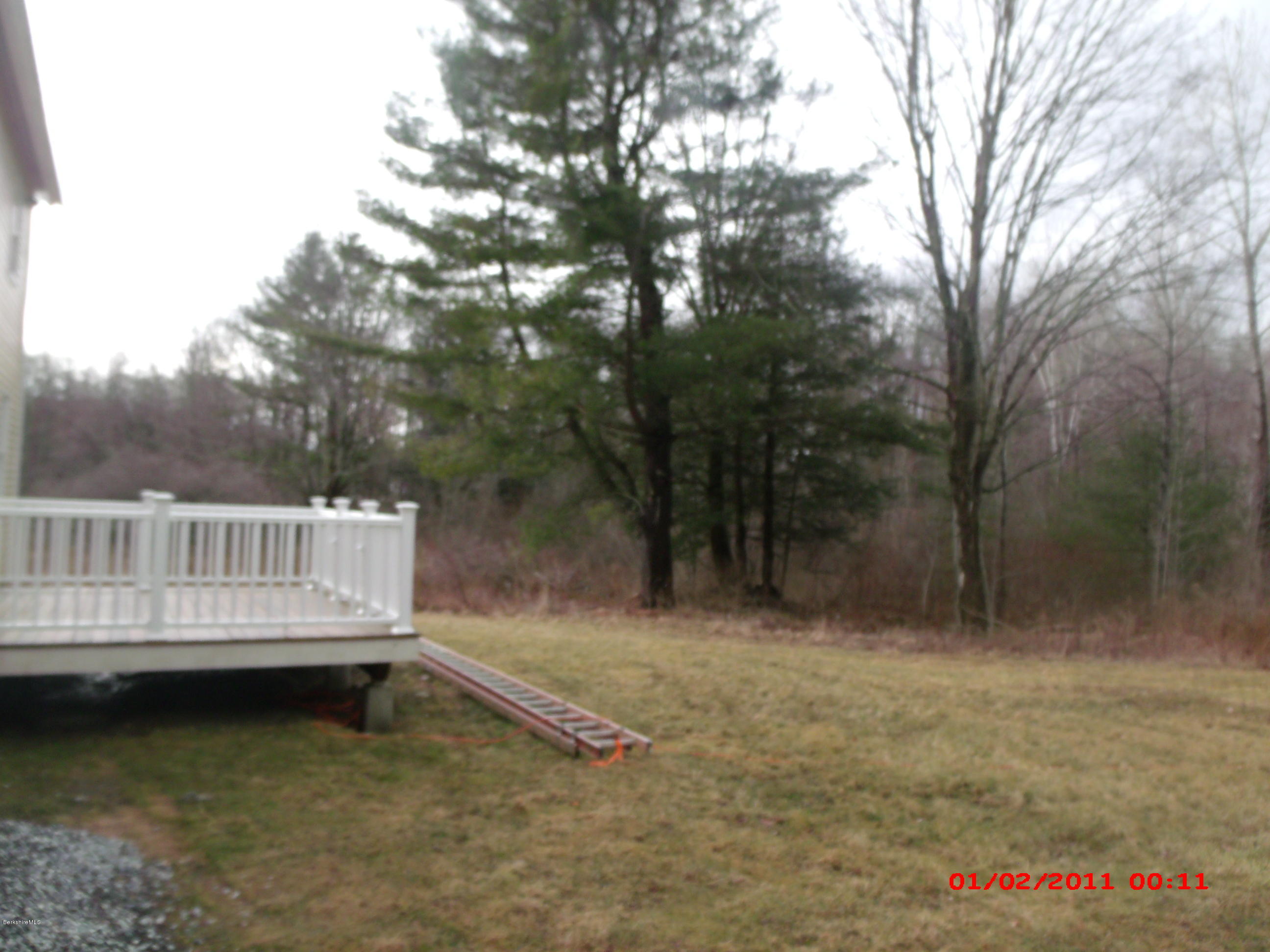 2986 State Road Richmond, MA 01254 - Photo 14 of 14 a view of a house with a yard from a lake