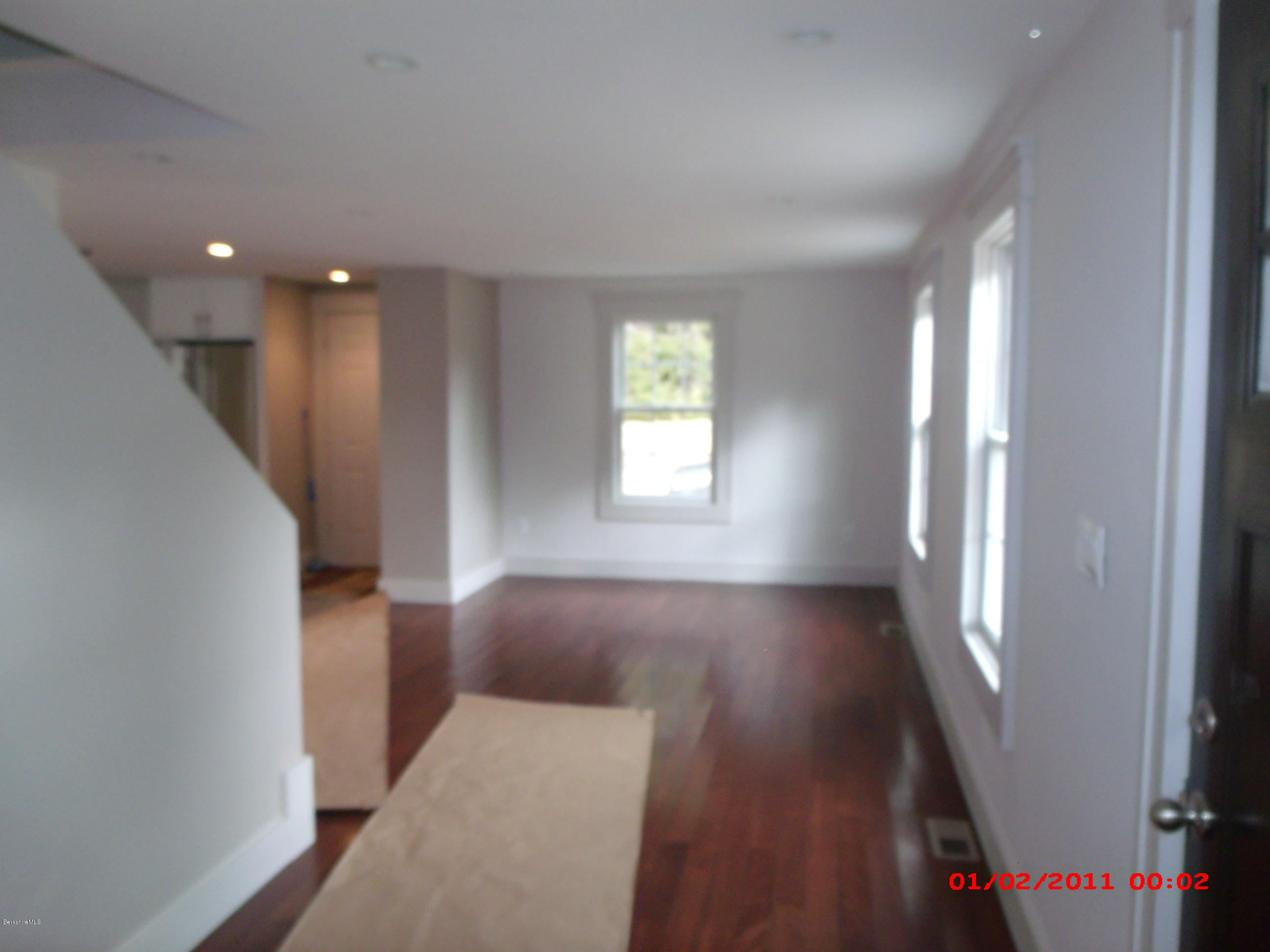 2986 State Road Richmond, MA 01254 - Photo 3 of 14 wooden floor in an empty room with a window