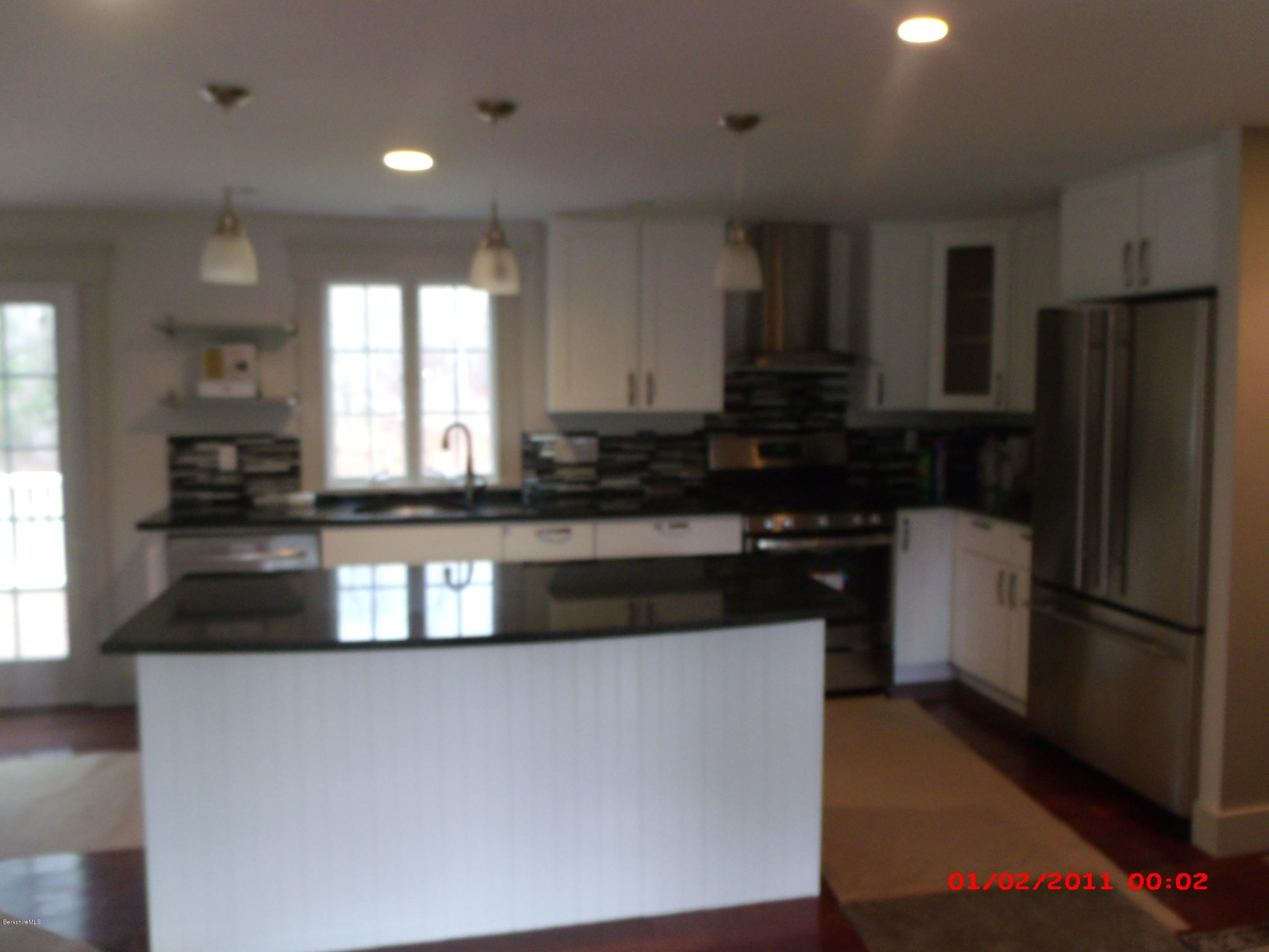 2986 State Road Richmond, MA 01254 - Photo 4 of 14 a kitchen with granite countertop a refrigerator and a stove top oven