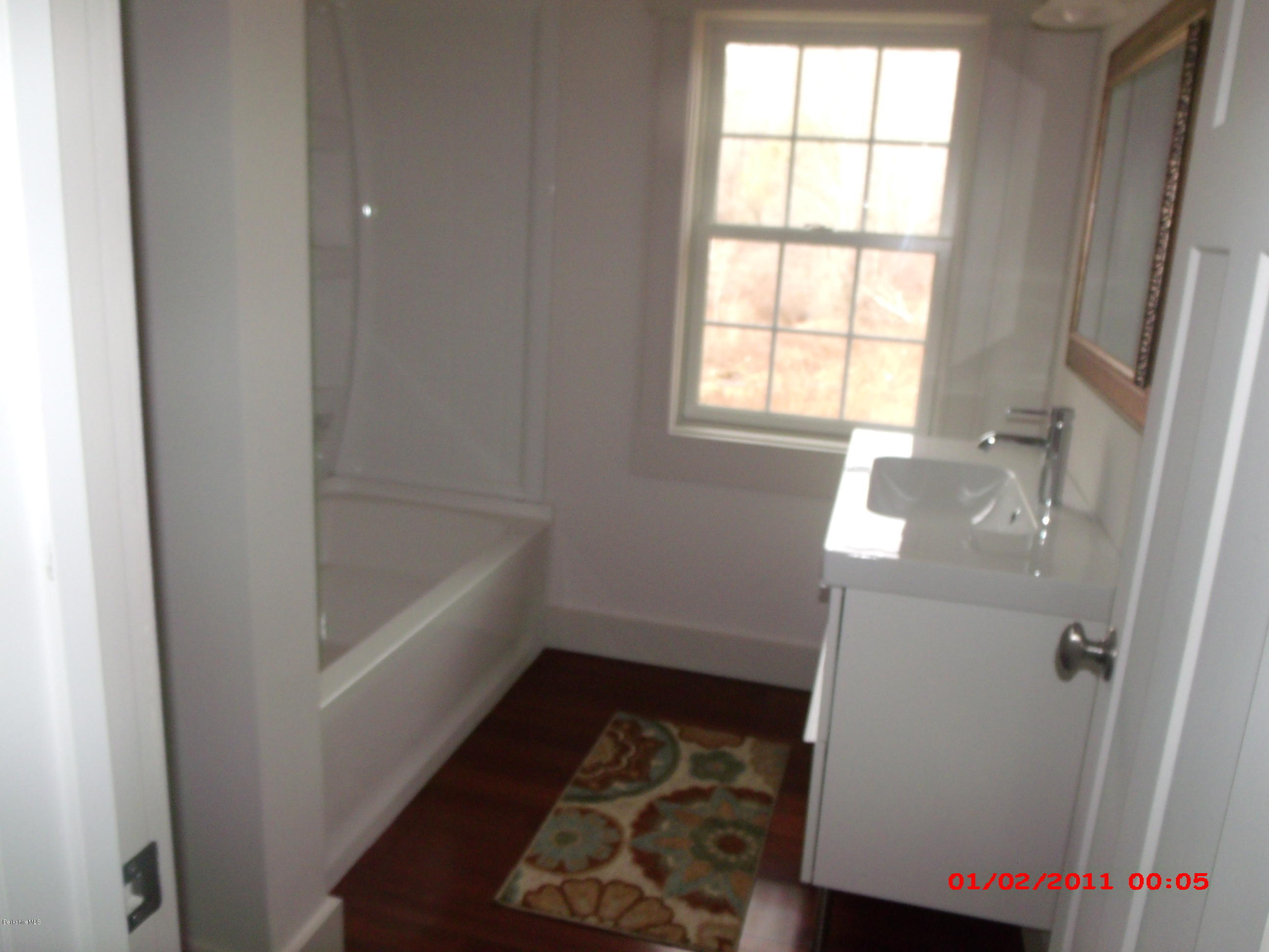 2986 State Road Richmond, MA 01254 - Photo 8 of 14 a bathroom with a bathtub and window