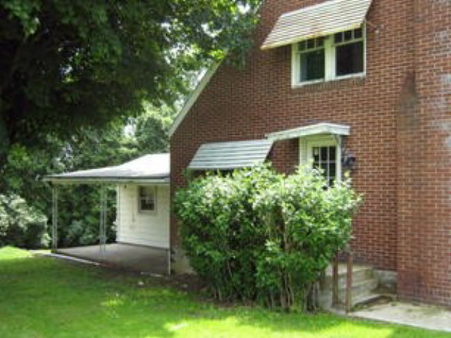 1998 Doc Walker Road Parker, PA 16049 - Photo 1 of 1 a front view of a house with a yard