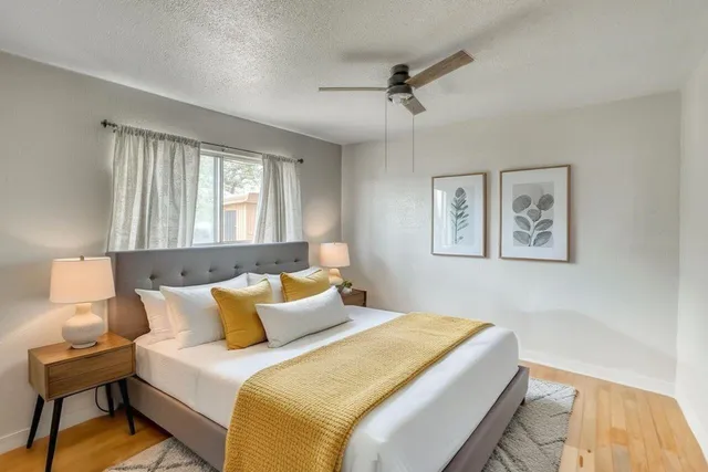 a bedroom with bed and window