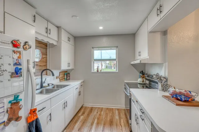 a bedroom with furniture and wooden floor