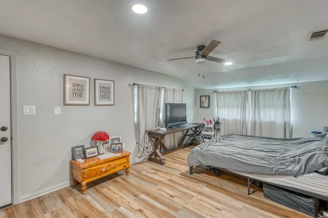 a bedroom with a bed and a dresser