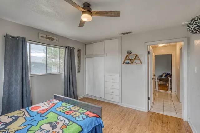 a bedroom with a bed and a dresser